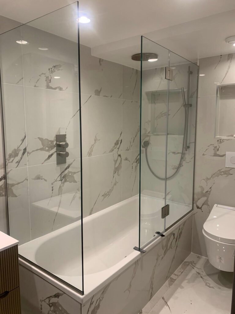 Frameless glass shower screen fitted in London by Zeenee Aluminium