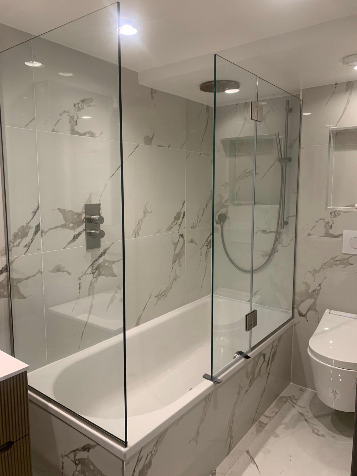 Frameless glass shower screen fitted in London by Zeenee Aluminium